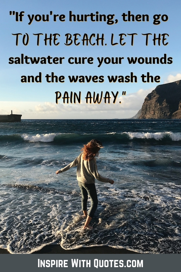 girl playing at the beach with a quote about the beach washing your pain away in the waves