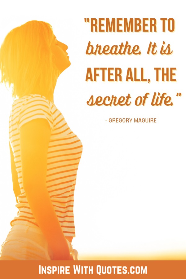 woman breathing with the sun glowing on her and quote about remembering to breathe