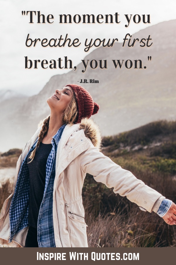 lady in a winter setting breathing deeply with the quote "the moment you breathe your first breath you won"